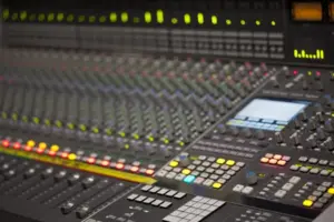 depositphotos_16781893-Large-Music-Mixer-desk-in-recording-studio